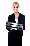 Female Executive Carrying Business Files Stock Photo