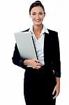 Female Executive Holding Laptop Stock Photo