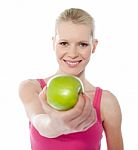 Female Giving Green Apple Stock Photo