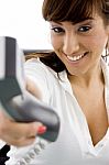 Female giving telephone Receiver Stock Photo