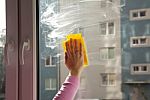 Female Hand Washing A Window Stock Photo