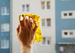 Female Hand Washing A Window Pane Stock Photo