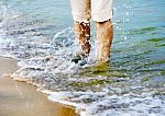 Female Legs With Sea Wave Stock Photo