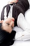 Female Lying Down On Floor Stock Photo