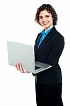 Female Manager Working On Laptop Stock Photo