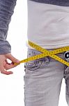 Female Measuring Her Waist With Tape Stock Photo