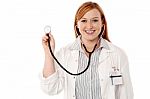 Female Physician Posing With Stethoscope Stock Photo