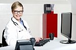 Female Physician Using Computer Stock Photo