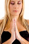 Female Praying With Closed Eyes Stock Photo