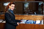 Female Receptionist Holding Records Stock Photo