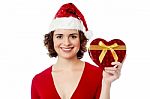 Female Santa Showing Xmas Gift Over White Stock Photo