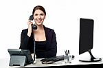 Female Secretary Answering Phone Call Stock Photo