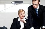 Female Secretary Explaining To Boss Stock Photo