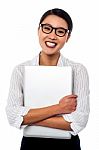 Female Secretary Holding Laptop Tightly Stock Photo