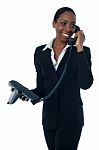 Female Secretary Speaking On Phone Stock Photo