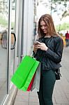 Female Shopper Texting Stock Photo