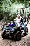 Female Sitting On ATV Stock Photo