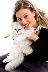 Female Smiling And Posing With Cat Stock Photo