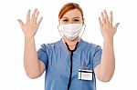 Female Surgeon Raising Her Arms Stock Photo