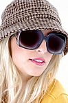 Female Wearing Sunglasses And Cap Stock Photo