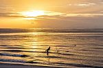 Fisherman Throwing Net , Fishing In The Morning On The Beach Stock Photo