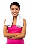 Fit Smiling Woman With Towel Around Her Neck Stock Photo