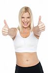 Fit Woman In Sports Bra Gesturing Double Thumbs Up Stock Photo