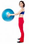 Fit Woman Posing With Big Blue Exercising Ball Stock Photo