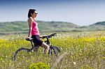 Fit Woman Riding Mountain Bike Stock Photo