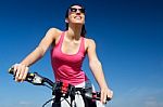 Fit Woman Riding Mountain Bike Stock Photo