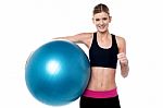 Fitness Girl With Aerobic Ball  Showing Thumbs Sign Stock Photo