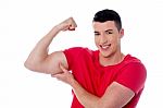 Fitness Man Showing Bicep Muscles Stock Photo