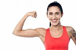 Fitness Trainer Flexing Her Biceps Stock Photo