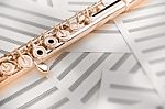 Flute On Sheet Music Stock Photo