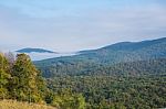 Fog Partially Covering Hills Stock Photo