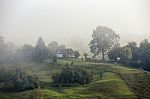 Foggy Morning In A Village On The Hills Stock Photo