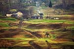 Foggy Spring Morning In Mountain Village. Fields And Hills Stock Photo