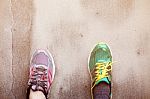 Foot With Shoes On Wall Stock Photo