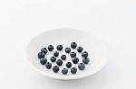 Fresh Blueberries On A White Plate Stock Photo