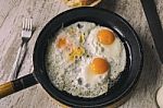 Fresh Fried Eggs On Oil Stock Photo