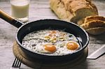 Fresh Fried Eggs On Oil Stock Photo