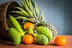 Fresh Fruits On A Wooden Stock Photo