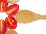 Fresh Grape Or Cherry Tomato With Wooden Spoon On White Backgrou Stock Photo