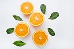 Fresh Orange Citrus Fruit On White Background. Top View Stock Photo