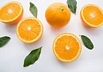 Fresh Orange Citrus Fruit On White Background. Top View Stock Photo