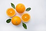 Fresh Orange Citrus Fruit On Wooden White Background. Top View Stock Photo