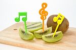 Fresh Sliced Kiwi Fruit And Knife On Wooden Board Stock Photo