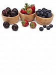 Fresh Summer Fruits, Cherry, Strawberry, And Blueberry In Wooden Stock Photo