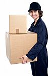 Friendly Delivery Woman In Uniform Stock Photo