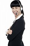 Friendly Female Telephone Operator At Your Service Stock Photo